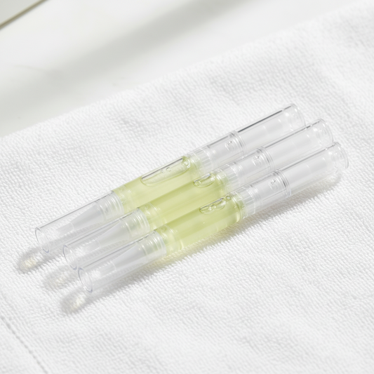 Nail and cuticle oil on white towel