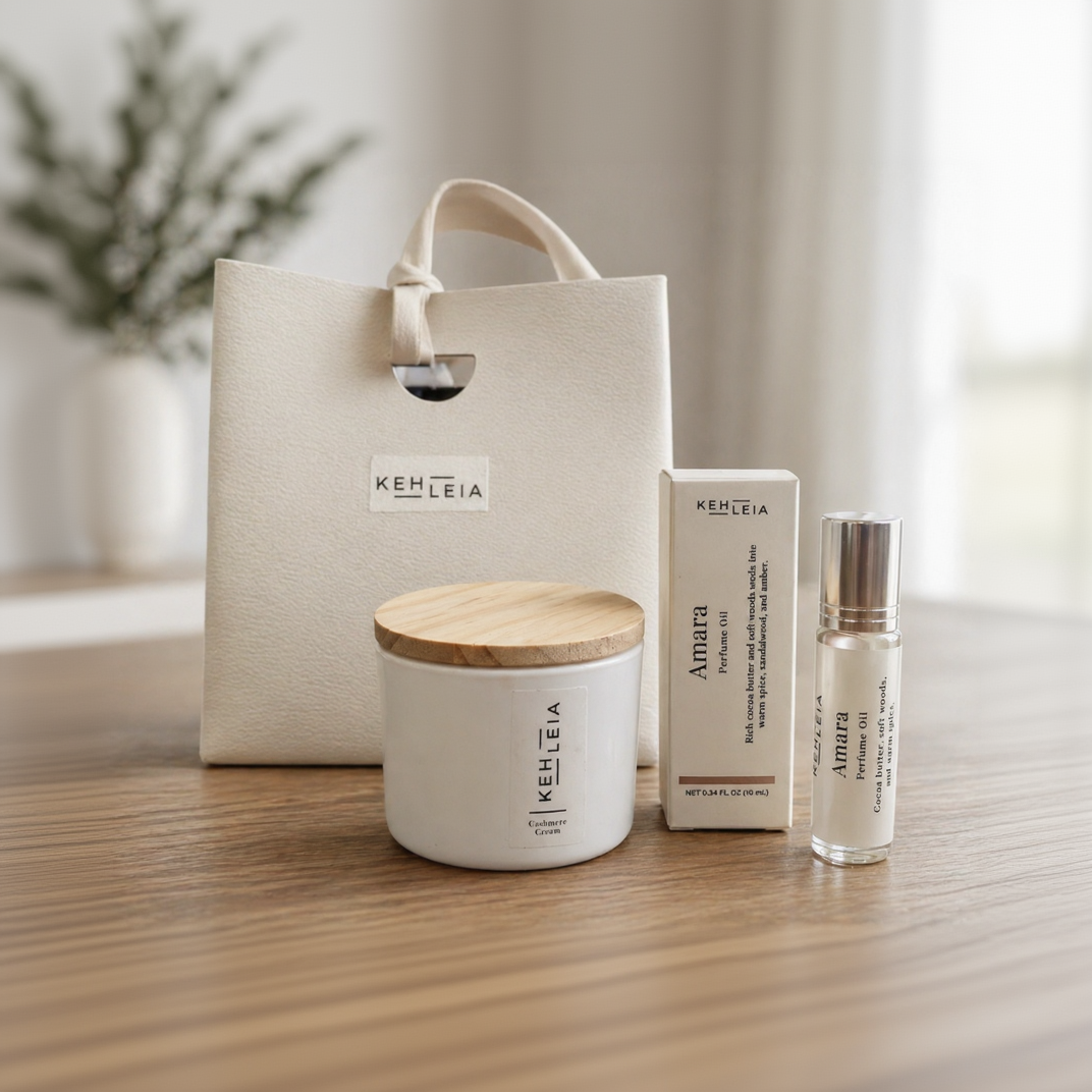 Kehleia products including a candle, box, and bottle on a wooden surface with a blurred background.